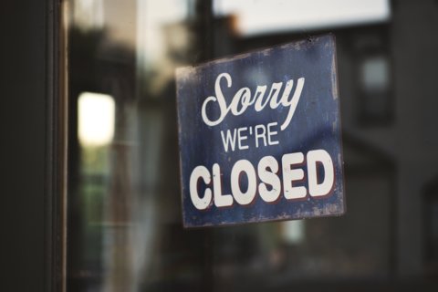 closeup-shot-sign-that-says-sorry-we-re-closed-hanging-glass-door